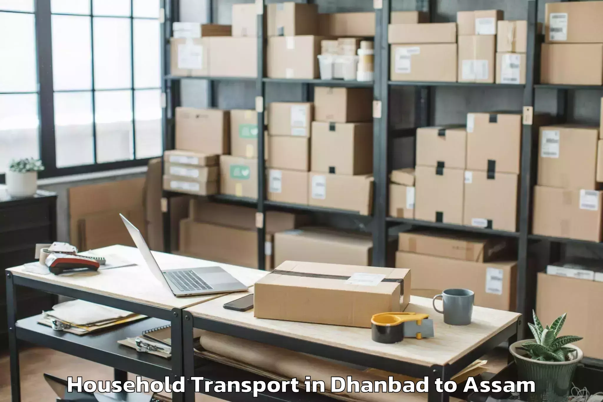 Top Dhanbad to Mirza Kamrup Household Transport Available